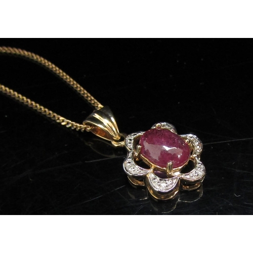 6072 - A 9ct gold ruby cabochon and diamond chip pendant hung on a fine gold chain, 46cm long, 4.7g