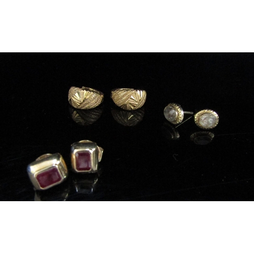 6136 - Three pairs of earrings including ruby stud earrings, gold hoops etc, 7.3g