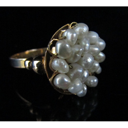 6142 - A gold ring with circular front with pearl wirework detail. Size O, unmarked, 4.1g