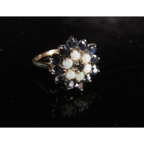 6216 - A 9ct gold sapphire and opal cluster ring. Size O/P, 3.1g