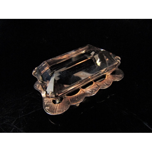 6217 - A large rectangular smoky quartz pendant/brooch in a gold framed stamped 9ct