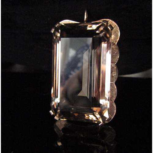 6217 - A large rectangular smoky quartz pendant/brooch in a gold framed stamped 9ct