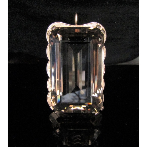 6217 - A large rectangular smoky quartz pendant/brooch in a gold framed stamped 9ct