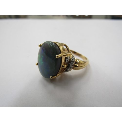 6229 - An 18ct gold solid opal and diamond ring. Size N, 8.9g          (R) £300