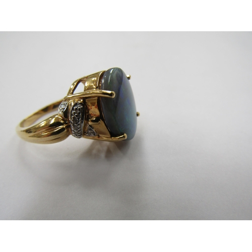 6229 - An 18ct gold solid opal and diamond ring. Size N, 8.9g          (R) £300