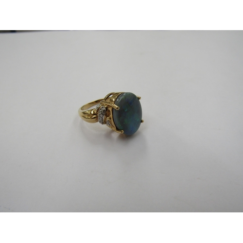 6229 - An 18ct gold solid opal and diamond ring. Size N, 8.9g          (R) £300