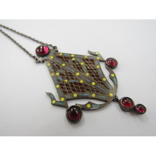 6232 - A silver pique a jour pendant with enamel decoration and red cabochons hung on chain, 15.6g      (R)... 