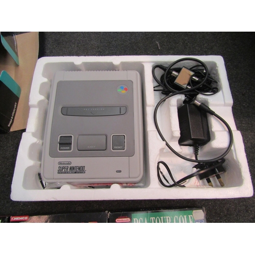 7028 - A boxed SNES Super Nintendo Entertainment System and games; PGA Tour Golf, PGA European Tour and Top... 