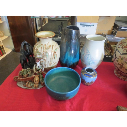 A collection of art pottery including Devonmoor, Chameleon ware, Marie