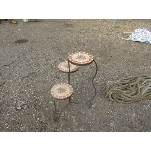 3449 - A metal tiled topped three tier pot stand