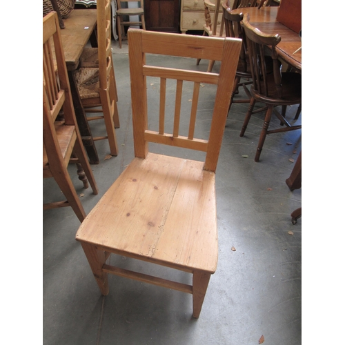 Four pine kitchen chairs