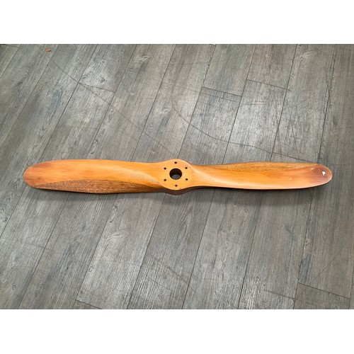 5004 - A segmented wood propeller, approx 125cm long.