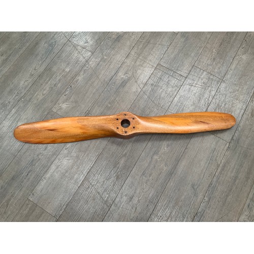 5004 - A segmented wood propeller, approx 125cm long.