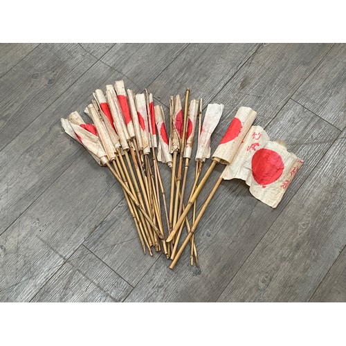 5030 - A quantity of Japanese paper and bamboo patriotic flags, thought to be WWII era