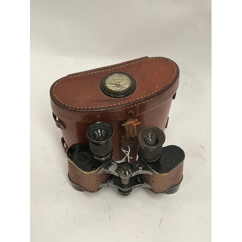 5062 - A pair of WWII US Signal Corps binoculars with brown leather case incorporating a compass to the lid