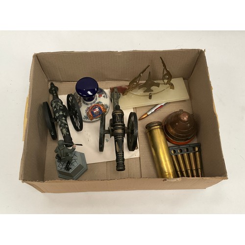 5112 - A box of miscellaneous including two model field guns, shell head etc