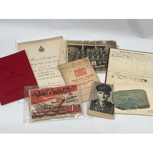 5120 - A folder of military ephemera including photographs and service books etc.