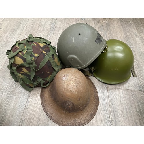 5170 - Two boxes and a basket containing mixed militaries including headwear, belts and kit bags, together ... 