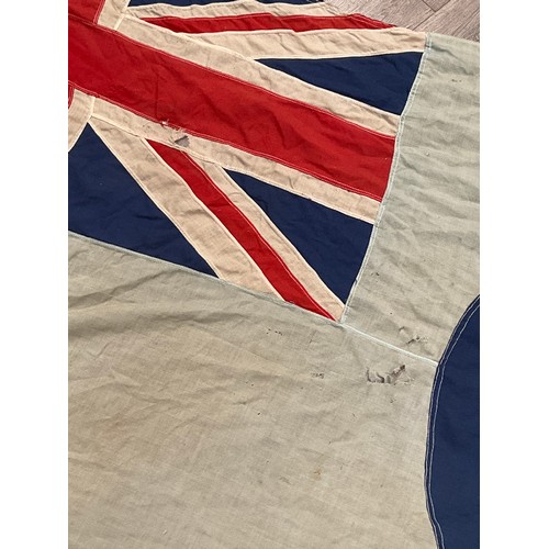 5238 - A WWII British RAF airbase flag, marks to lanyard indistinct, some damage, blue ground with target a... 