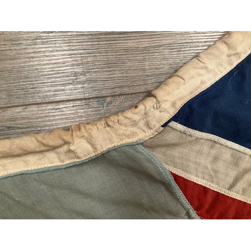 5238 - A WWII British RAF airbase flag, marks to lanyard indistinct, some damage, blue ground with target a... 