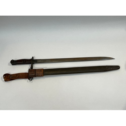 5279 - A WWI 1917 Remington bayonet with steel mounted leather scabbard and brown leather belt frog