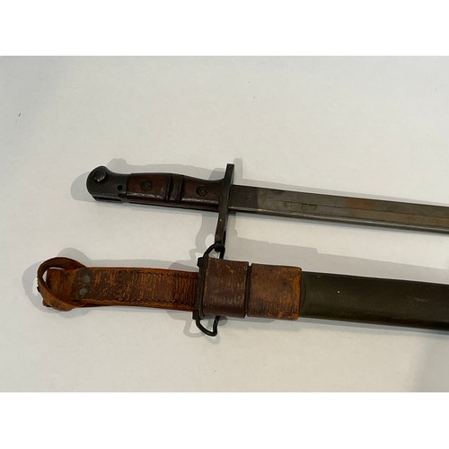 5279 - A WWI 1917 Remington bayonet with steel mounted leather scabbard and brown leather belt frog