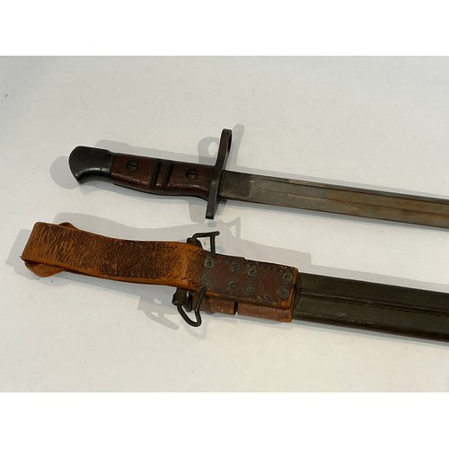 5279 - A WWI 1917 Remington bayonet with steel mounted leather scabbard and brown leather belt frog