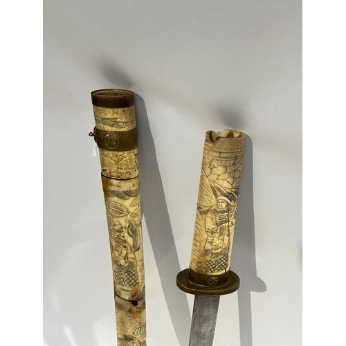 5289 - An Oriental sword with bone segmented scabbard carved with figures a/f