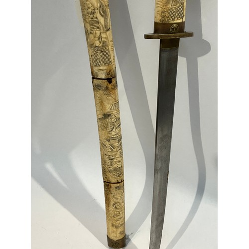 5289 - An Oriental sword with bone segmented scabbard carved with figures a/f