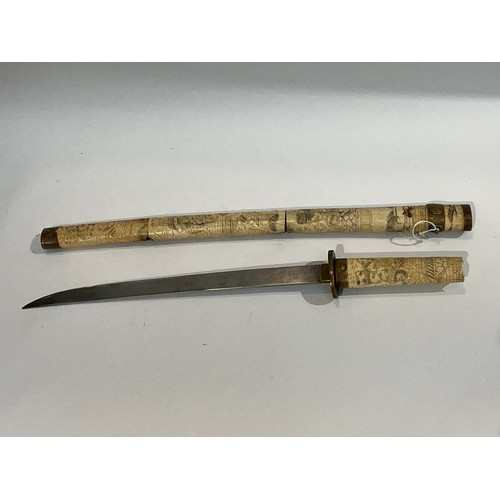 5289 - An Oriental sword with bone segmented scabbard carved with figures a/f