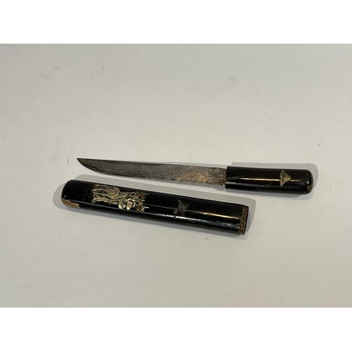 5290 - A Japanese miniature sword encased with black lacquered handle and scabbard, set with white metal de... 