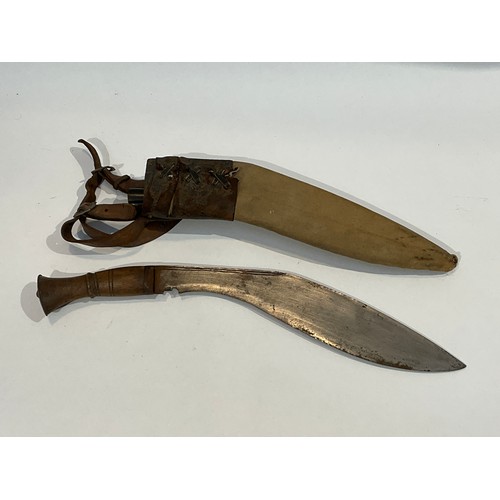 5298 - A WWII kukri together with canvas and brown leather sheath with one of two knives. Provenance Belive... 