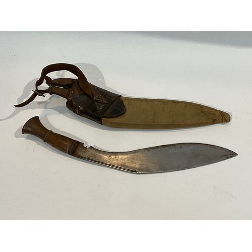 5298 - A WWII kukri together with canvas and brown leather sheath with one of two knives. Provenance Belive... 