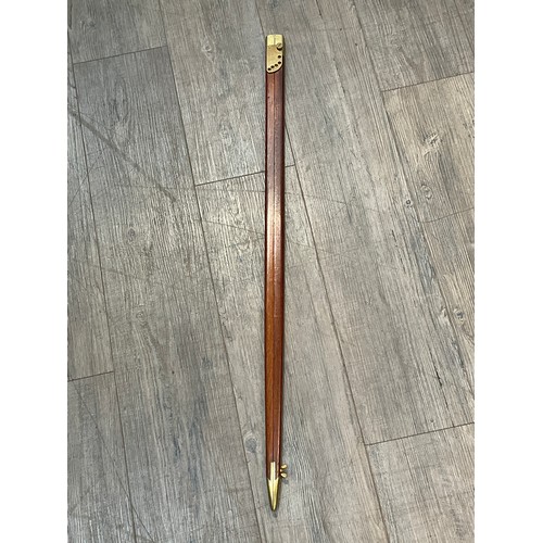 5302 - A mahogany and brass officer's pace stick