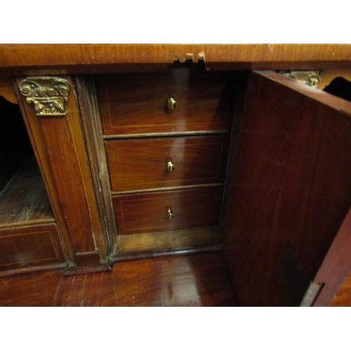 4115 - A Circa 1850's Dutch walnut bombe bureau the serpentine shape fall having a well fitted interior and... 