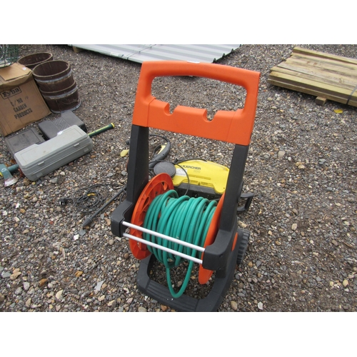 3413 - A Kärcher pressure washer and a hose on reel.  DTI Failure: Please see information pages