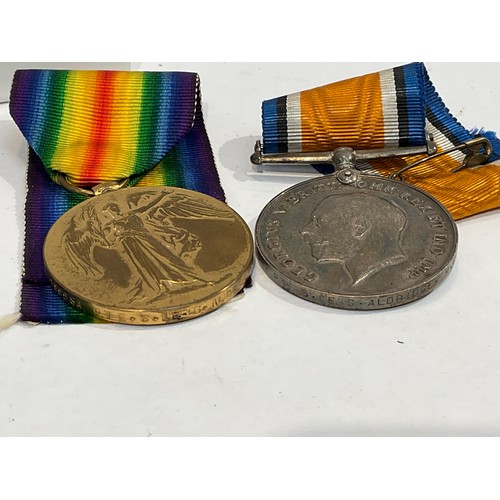 5349 - A WWI pair of medals named to 155584 G. ALDRIDGE M.G.C. (Machine Gun Corps) and other insignia