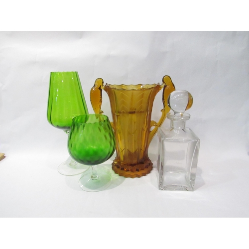 4250 - An etched glass decanter, two green oversized glasses, an amber art deco glass twin handled vase (ha... 