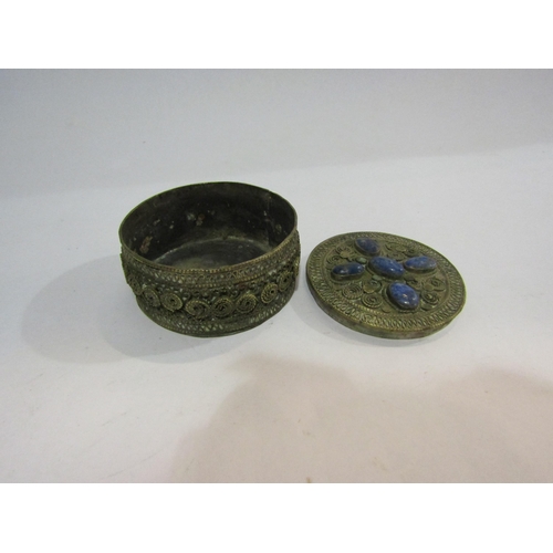 4296 - An Indian metal circular trinket box with cabochon stone top, 7.5cm diameter