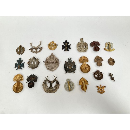 5405 - A collection of British military cap badges including Scottish, Fusilier and Royal Flying Corps (RFC... 