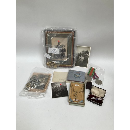 5422 - A box of mixed militaria including a pair of WWII medals, badges and ephemera