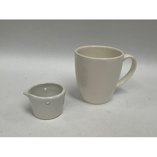 5445 - A WWII German Kriegsmarine U-Boat mug and milk jug in white. The mug marked with Bauscher Weiden Unt... 