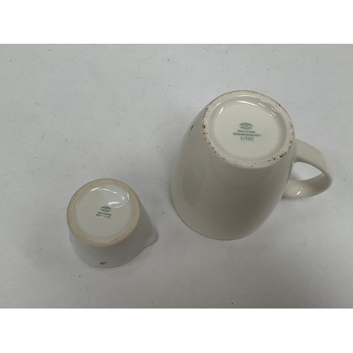 5445 - A WWII German Kriegsmarine U-Boat mug and milk jug in white. The mug marked with Bauscher Weiden Unt... 