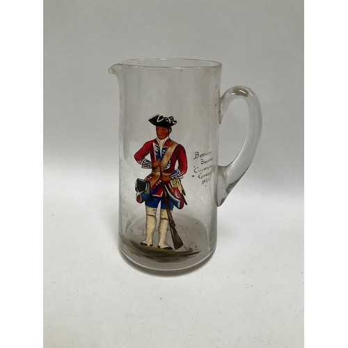 5453 - A Victorian clear glass water jug with hand-painted figure of 