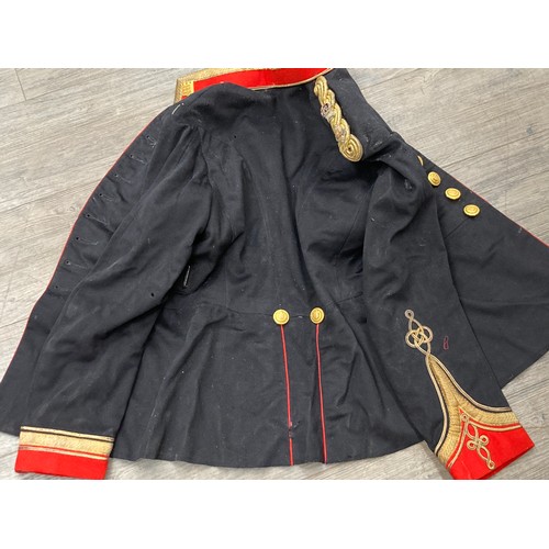 5490 - An Edward VII era Army Ordnance mess dress jacket with trousers, insignia and webbing etc, moth dama... 