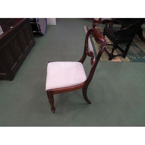 4059 - A William IV rosewood chair the carved back rest over a suede seat on turned and fluted tapering leg... 