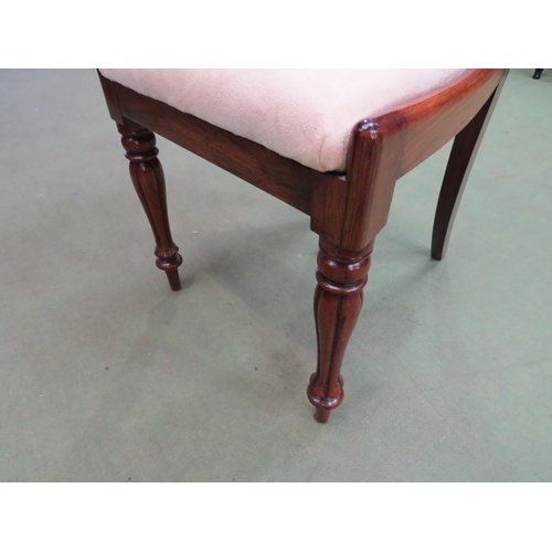 4059 - A William IV rosewood chair the carved back rest over a suede seat on turned and fluted tapering leg... 