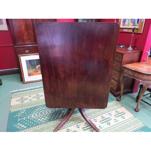 4061 - Circa 1800 a mahogany tilt top table, the reeded edge top over a turned column and outswept legs on ... 