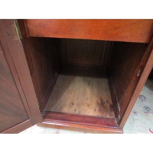 4095 - A 19th Century mahogany twin pedestal desk, the three frieze drawers over two single door cupboards ... 