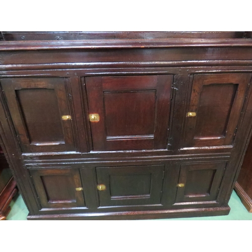 4117 - A Circa 1700 English pegged oak court cupboard with unusual bank of nine cupboard panelled doors hav... 